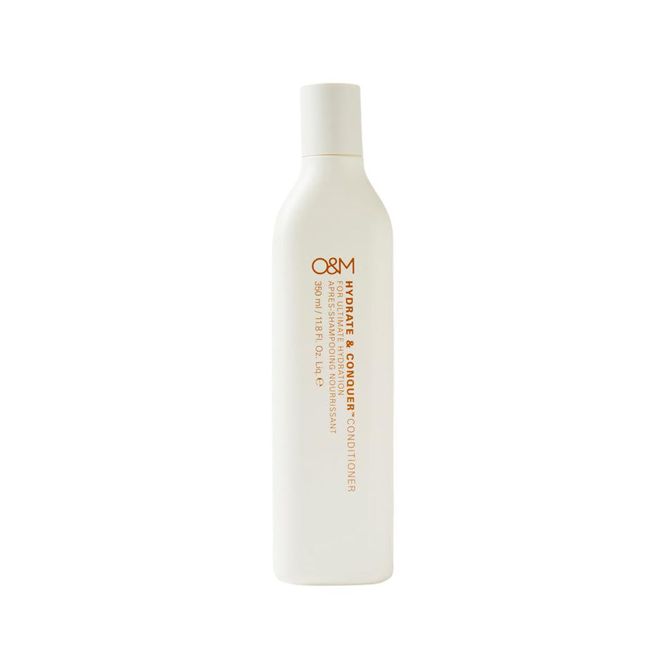 O&M bottle front view showing label and volumizing benefit