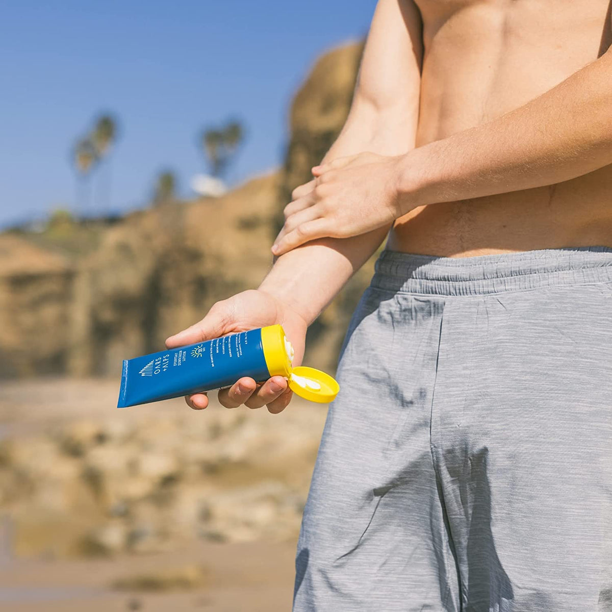 Oars + Alps being applied to forearm demonstrating non-greasy absorbency