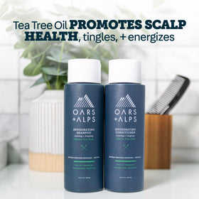 Oars + Alps shampoo bottle on shower shelf portraying daily use