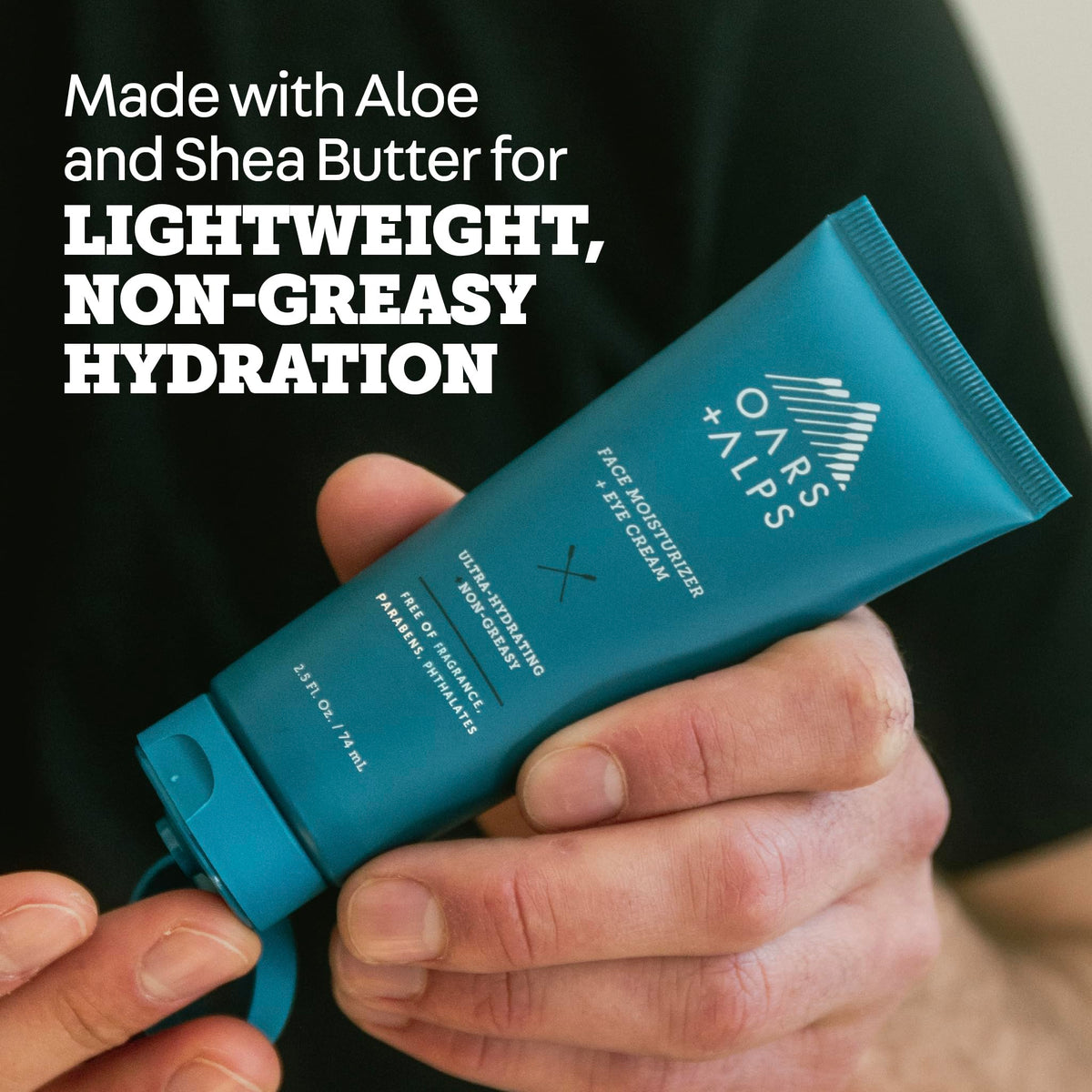 Oars + Alps cream being dabbed under eye to show gentle application and soothing benefit