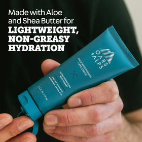 Oars + Alps cream being dabbed under eye to show gentle application and soothing benefit