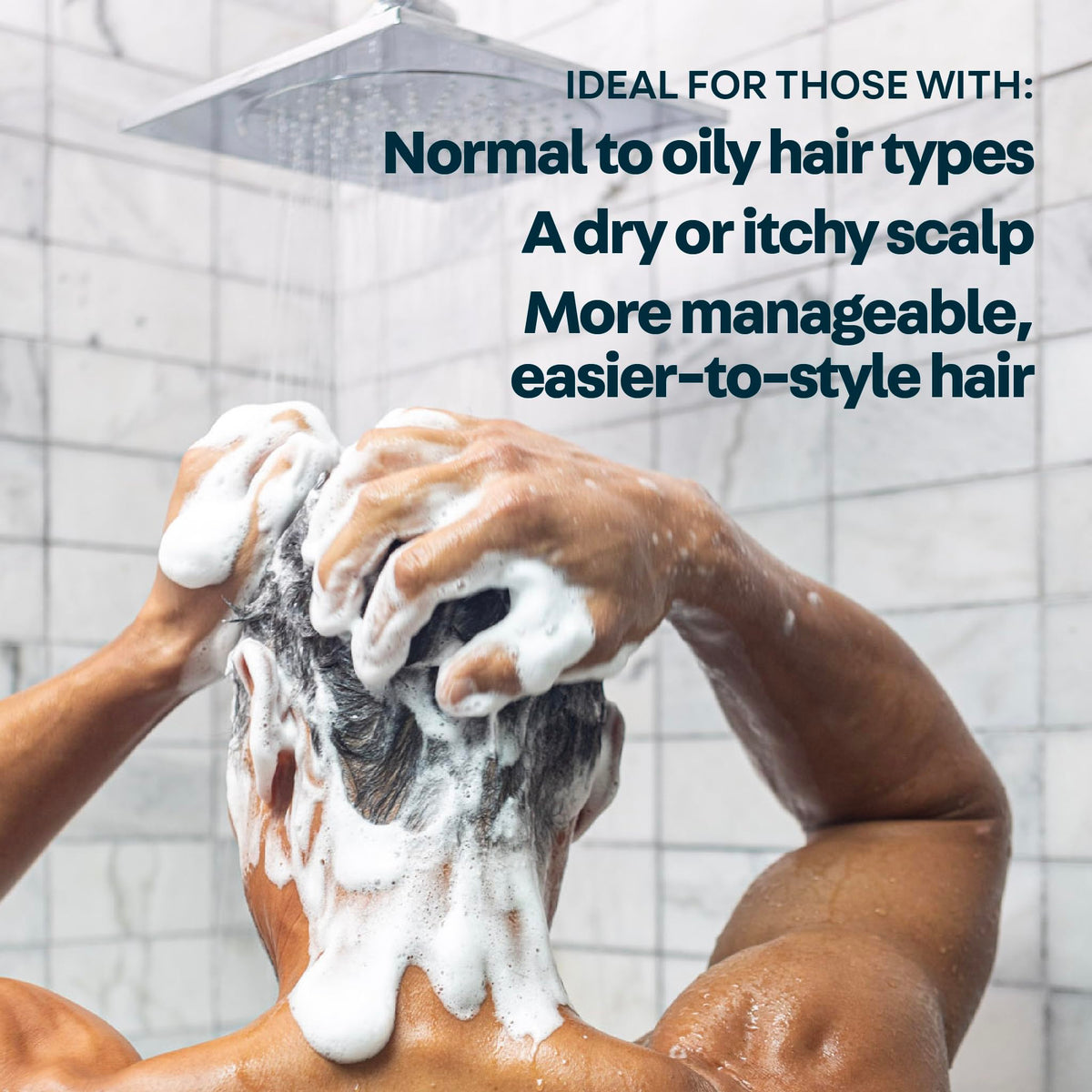 Man using Oars + Alps shampoo in shower showing cooling scalp refresh