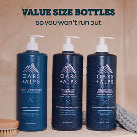 Oars + Alps bottle on shower shelf in modern bathroom for refreshed grooming
