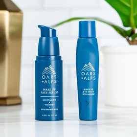 Oars + Alps eye roller beside travel bag for on-the-go depuffing