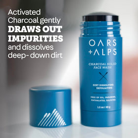 Oars + Alps stick in hand demonstrating compact size and easy, no-mess application