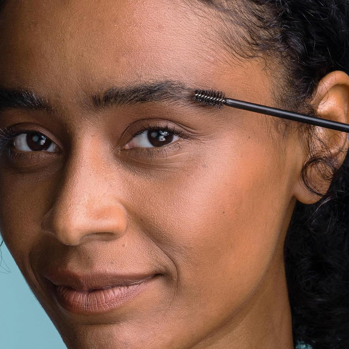 Obagi applying eyebrow serum along browline showing targeted coverage