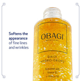 Obagi Medical serum drop on fingertip showing lightweight texture and fast absorption benefit