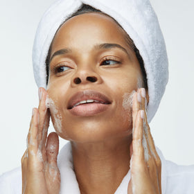 Obagi Medical bottle on sink emphasizing daily cleansing routine benefits
