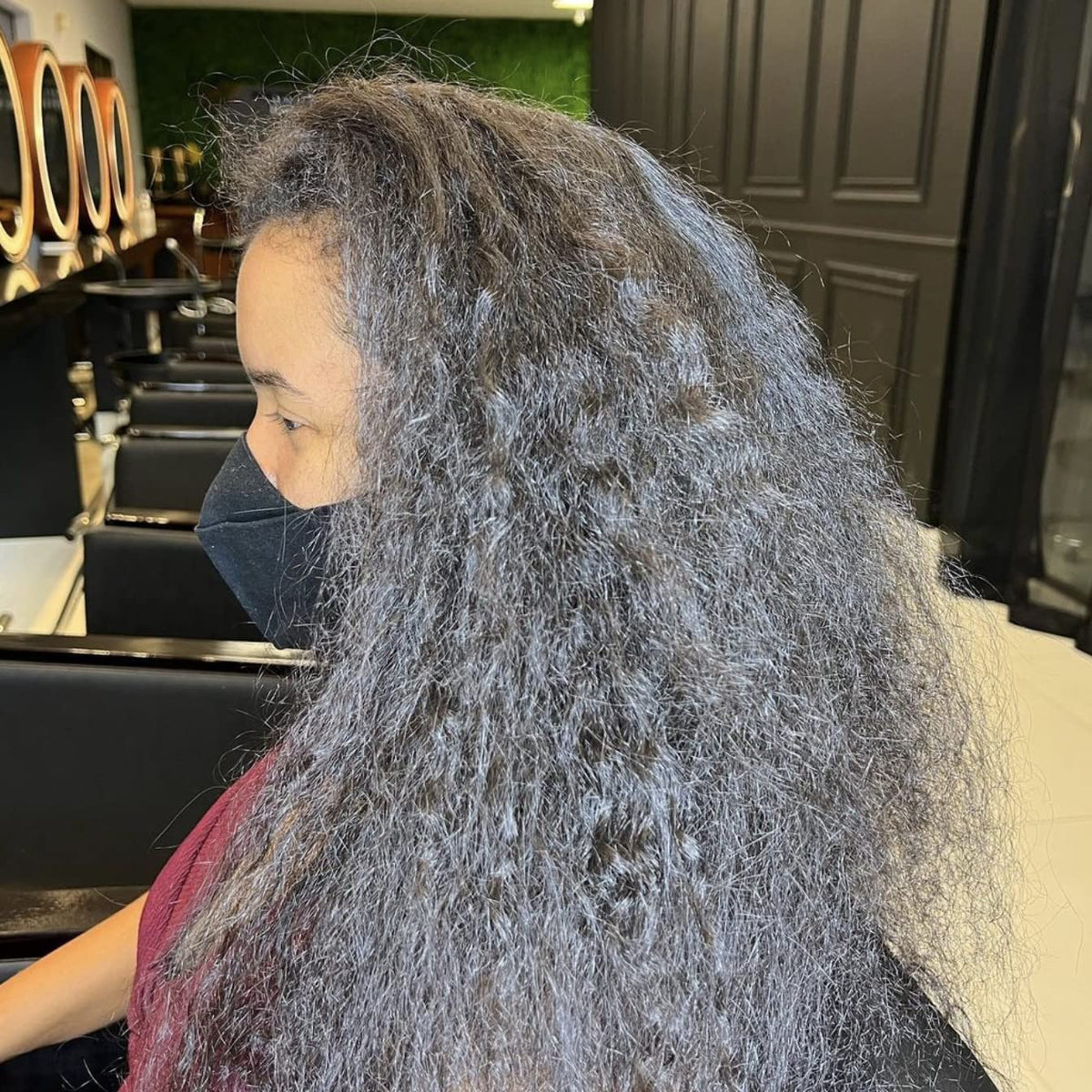 OGC Cosmetics being applied on hair strand demonstrating repair benefit