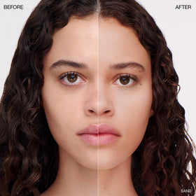 Ogee powder being applied with a brush, seamless blending for an even complexion