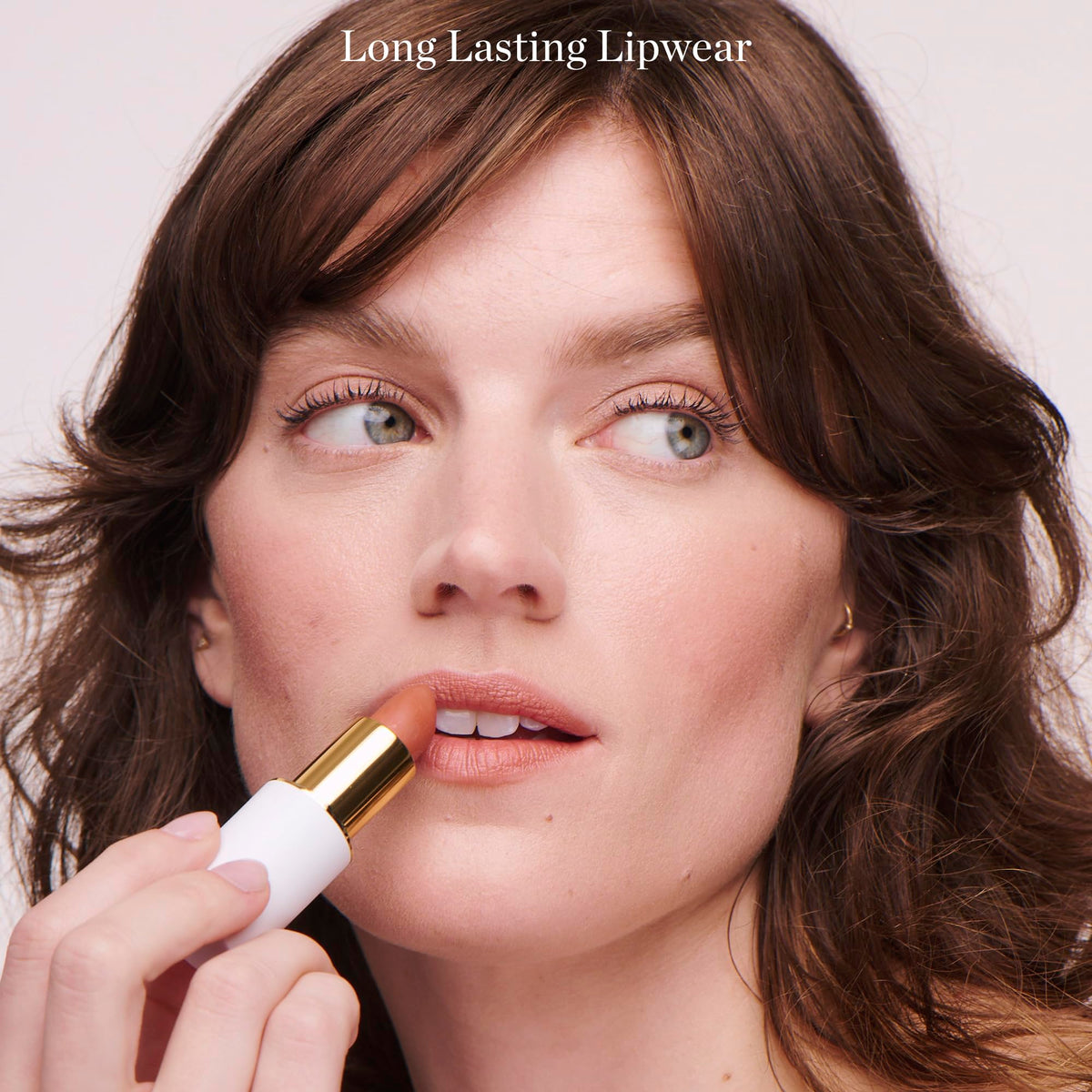 Ogee on-model lips wearing Lulu white pink for flattering everyday color