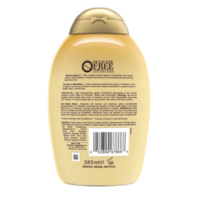 OGX bottle on bathroom shelf in lifestyle scene showing everyday hair care benefit