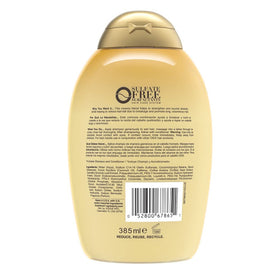 OGX pump and label detail highlighting key ingredients and strengthening promise
