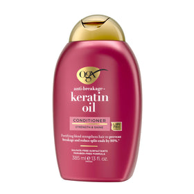 OGX conditioner paired with shampoo on bathroom shelf suggesting coordinated hair routine