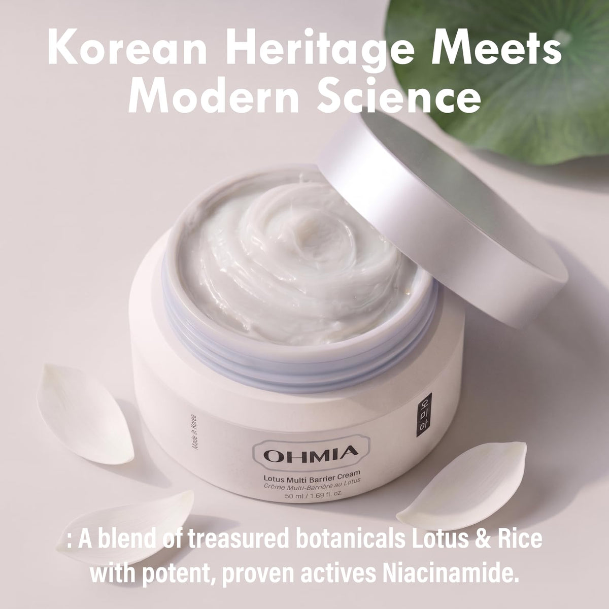 OHMIA applying cream to face in morning routine enhancing layering under sunscreen