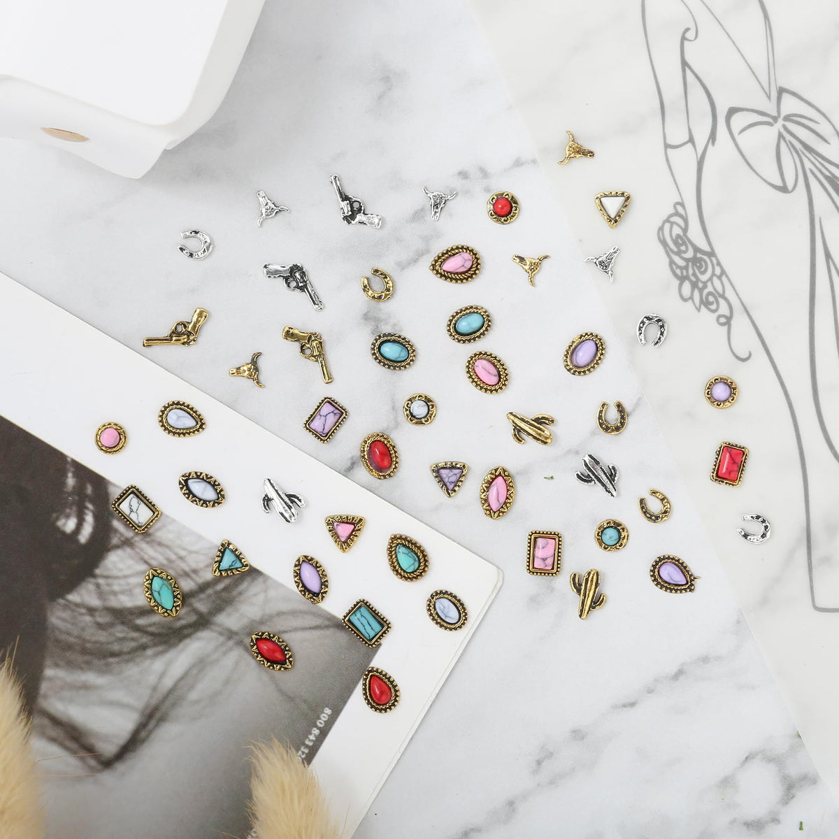Ohmique charms arranged on tray for nail application demonstrating easy placement