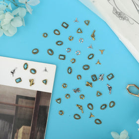 Ohmique sample nail with charms in place demonstrating finished look
