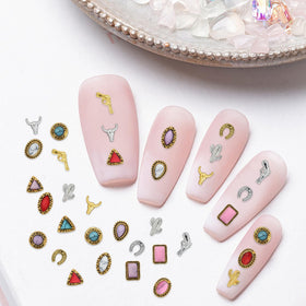 Ohmique charms next to coin for scale to show precise sizes for nails
