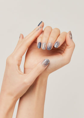 ohora applying a strip to a fingernail showing quick at-home polish benefit
