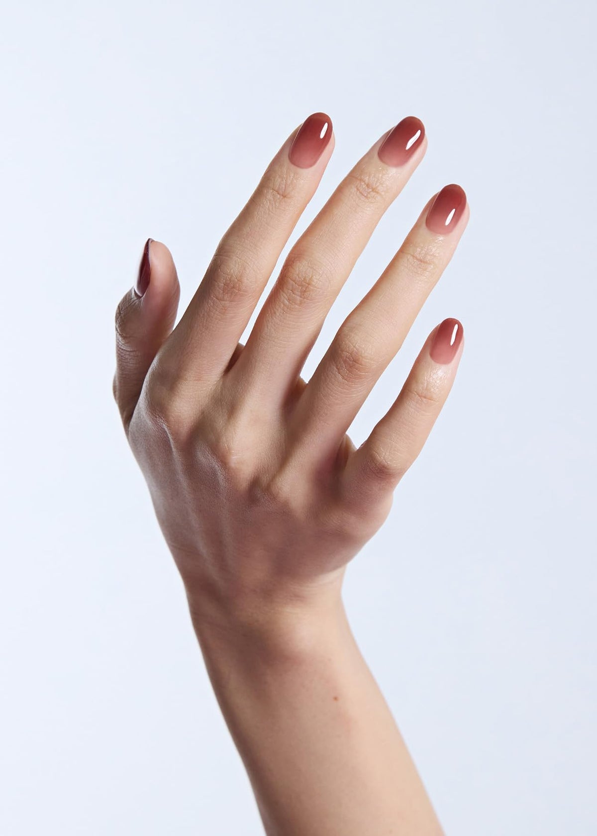 ohora on-model hands displaying polished pink ombre nails for salon-quality appearance
