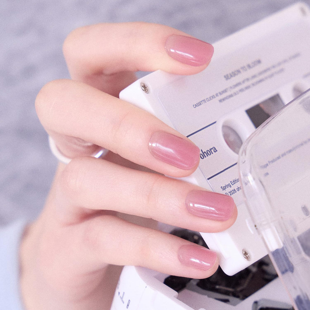 ohora strip on a fingernail close-up showing salon-quality purple shine