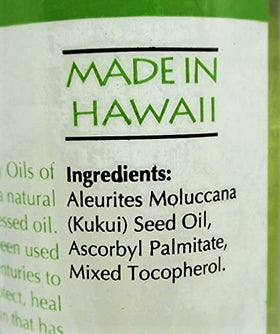 Oils of Aloha bottle in hand showing 4 fl oz size for travel convenience