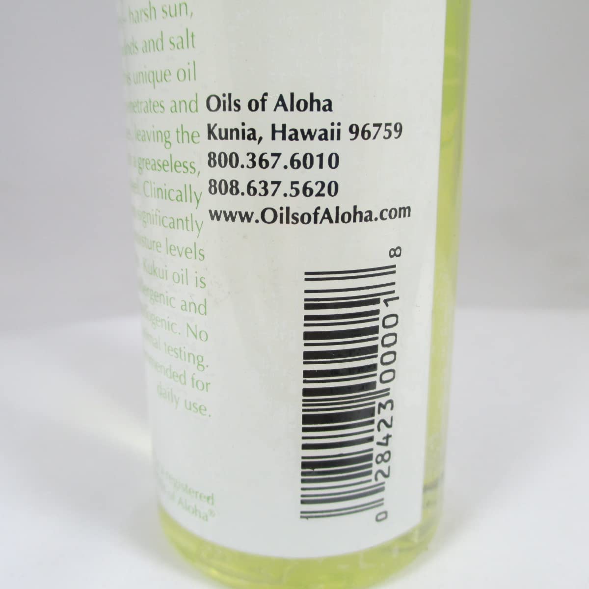 Oils of Aloha bottle on beach bathroom shelf suggesting natural routine