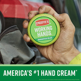 Hand applying O'Keeffe's Working Hands cream, soothes and protects dry hands