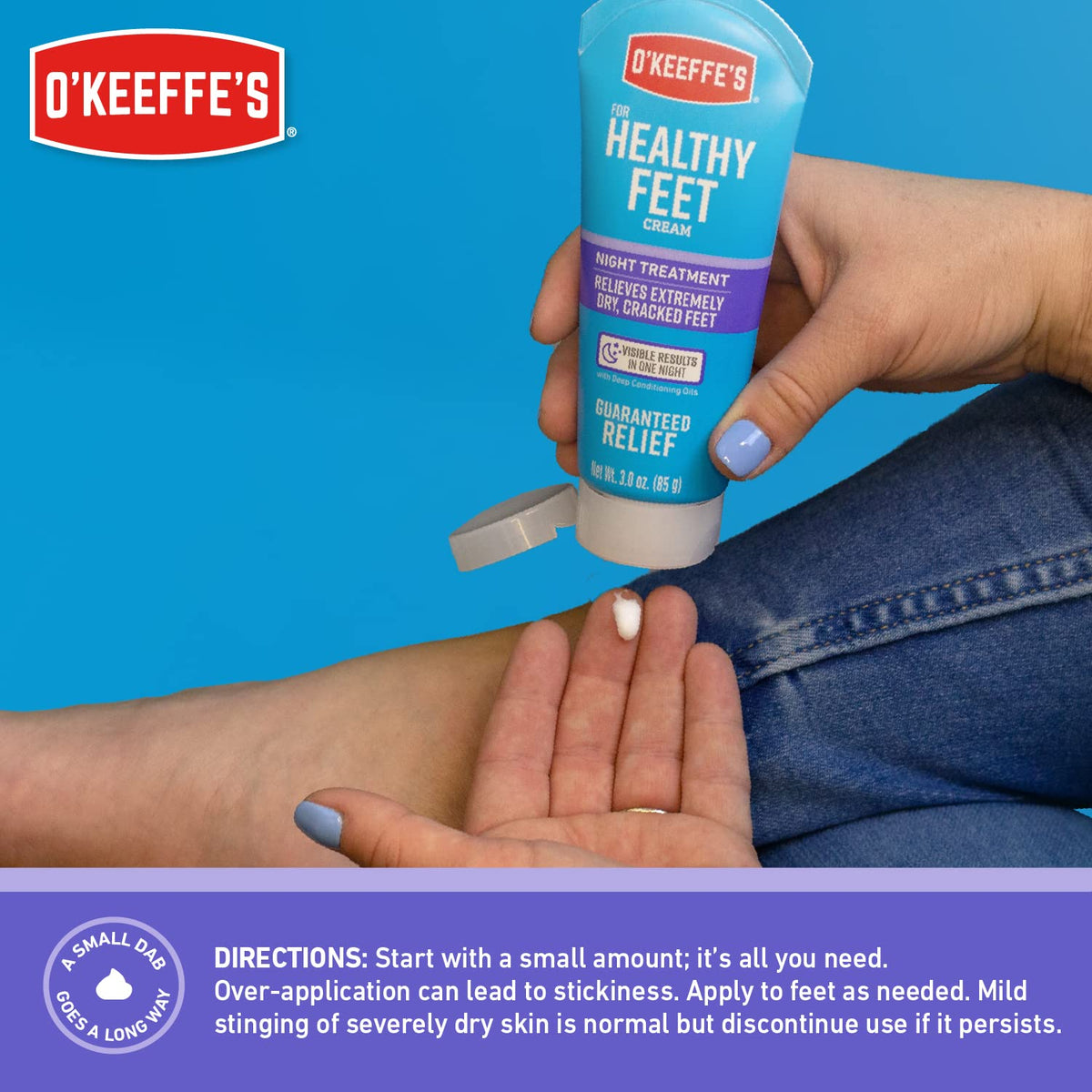 O'Keeffe's tube next to a hand to show true 7 ounce size and scale