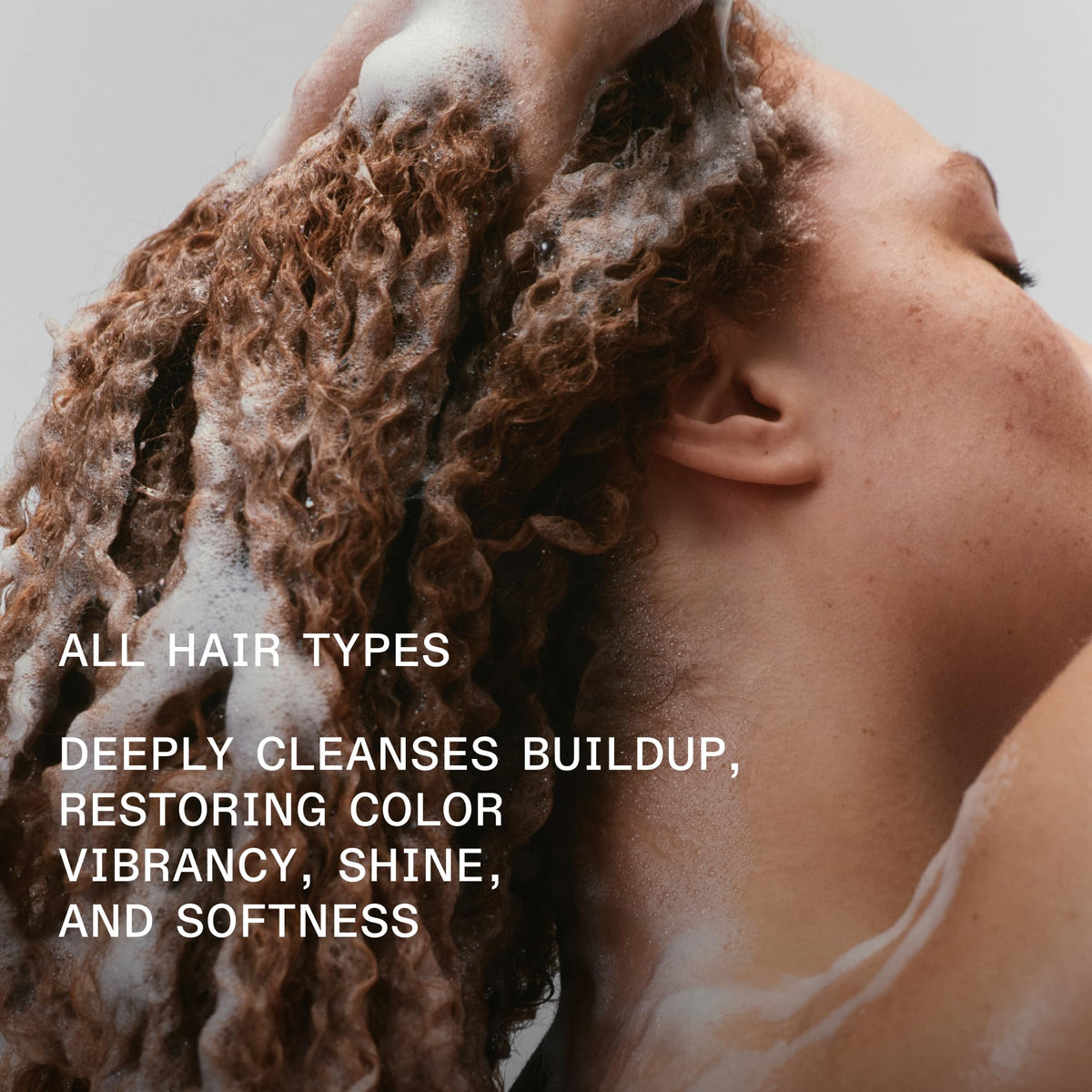 Rich white lather from Olaplex Nº.4C demonstrating deep-cleaning foam benefit