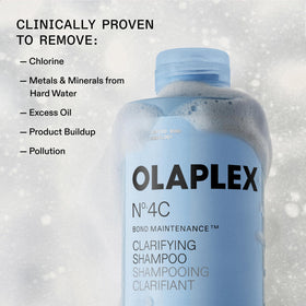 Applying Olaplex Nº.4C directly to scalp to remove buildup and refresh benefit