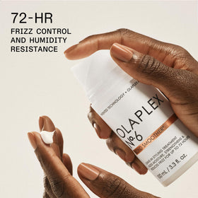 Olaplex N°7 oil drop on hair reflecting instant shine and heat protection