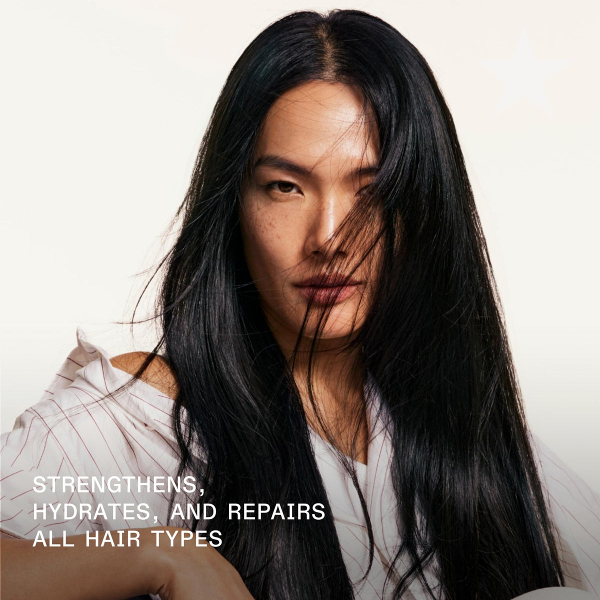 Olaplex creamy shampoo texture dispensed on palm for hydration benefit