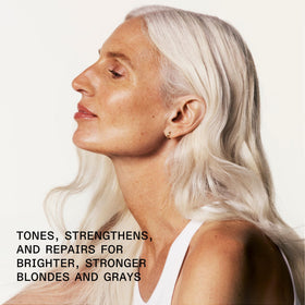 Olaplex Nº.4P foaming on wet hair in shower to tone and cleanse benefit