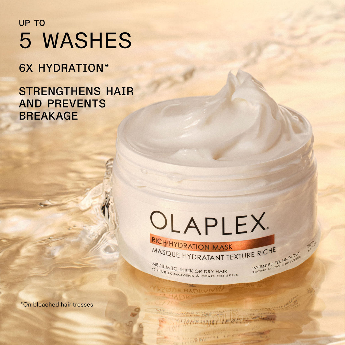 Olaplex mask being applied to damp hair to lock in moisture