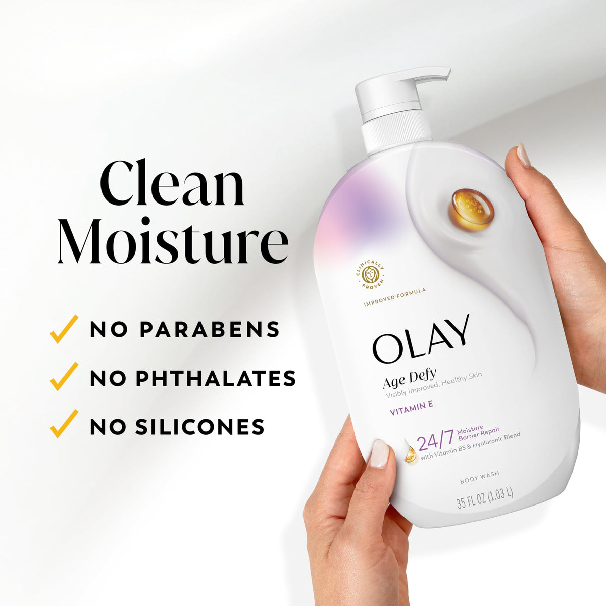 Olay bottle next to hand for scale showing generous 22 fl oz size