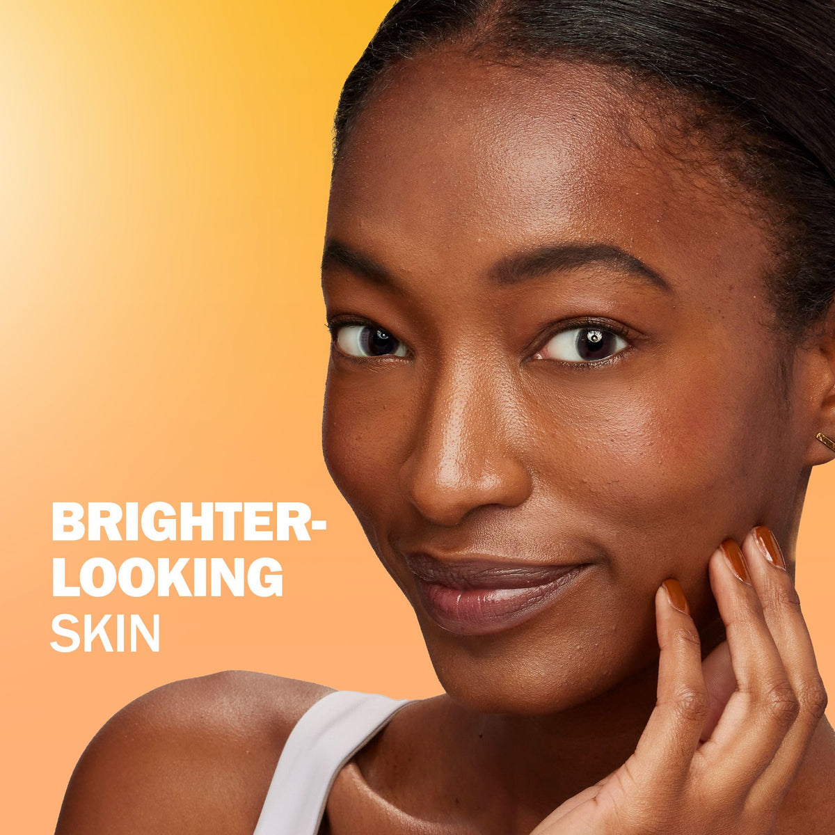 Olay bottle paired with moisturizer and SPF, shows easy layering benefit