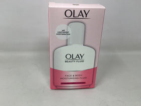 Olay bottle beside everyday objects to show 100ml travel-friendly size benefit