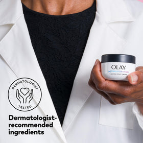 Olay applying cream to cheek demonstrating simple nightly routine benefits