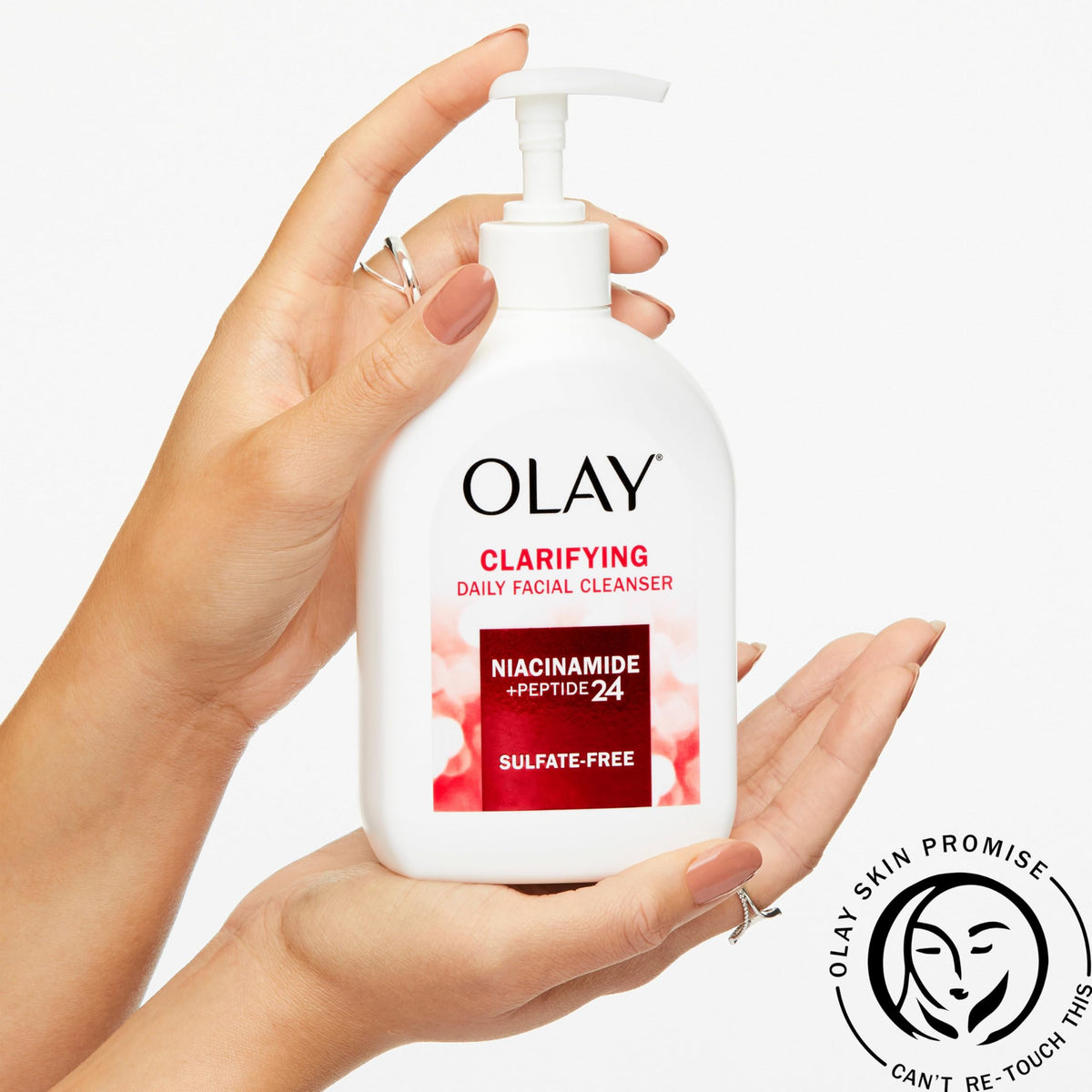Olay pump in hand demonstrating size and hygienic dispensing benefit