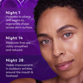 Olay bottle staged on nightstand with lamp, suggesting evening use benefit