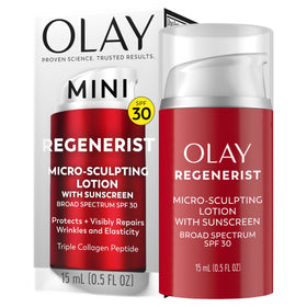 Olay 0.5 oz jar next to coin to illustrate compact travel size