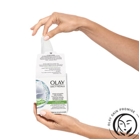 Olay cloth beside a hand to show scale and portable size