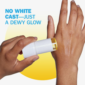 Olay stick held in hand to show compact travel size and portability