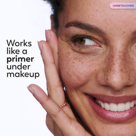 Outdoor application of Olay cream emphasizing sun protection benefit
