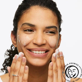 Olay applied to wet face during cleansing showing gentle removal of impurities