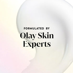 Olay being applied with a loofah in shower showing easy lathering and coverage
