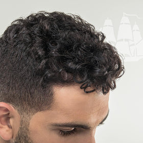 Old Spice conditioner tube open with creamy pour demonstrating detangling and moisture benefits