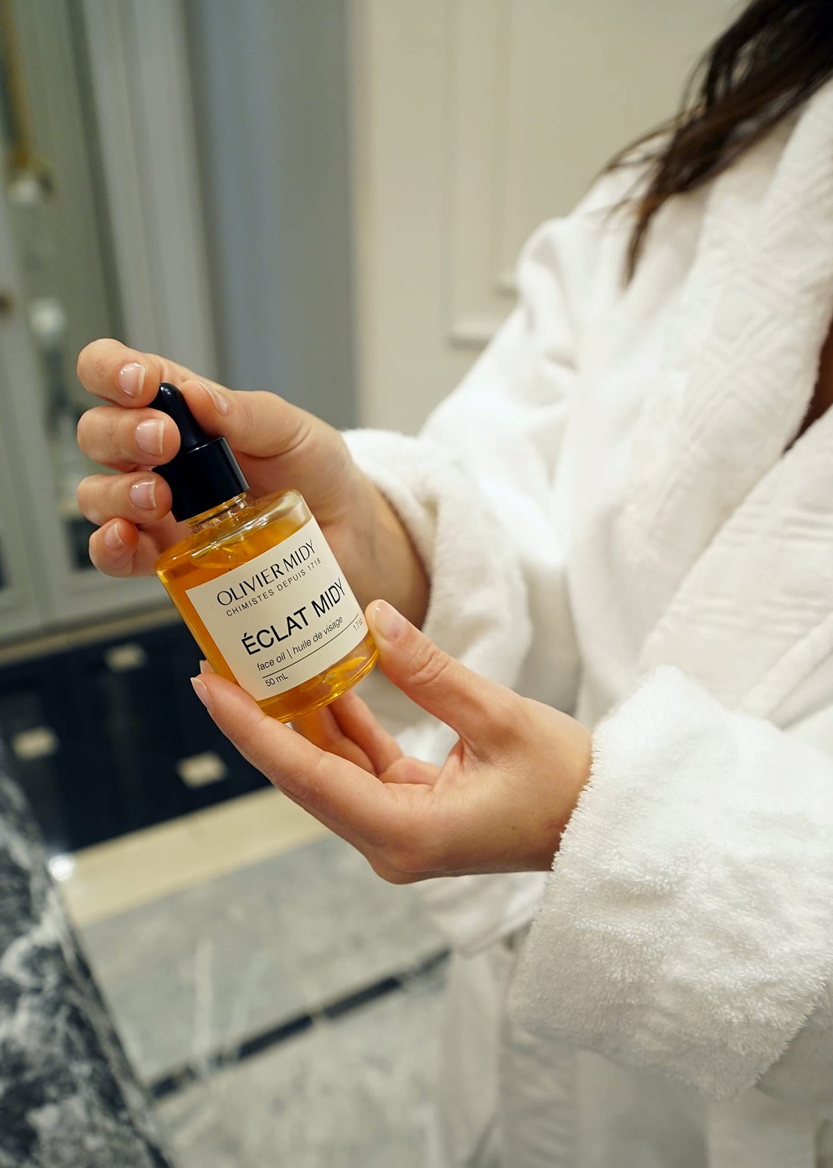 Olivier Midy in bathroom setting on counter showing everyday routine integration and aesthetic appeal