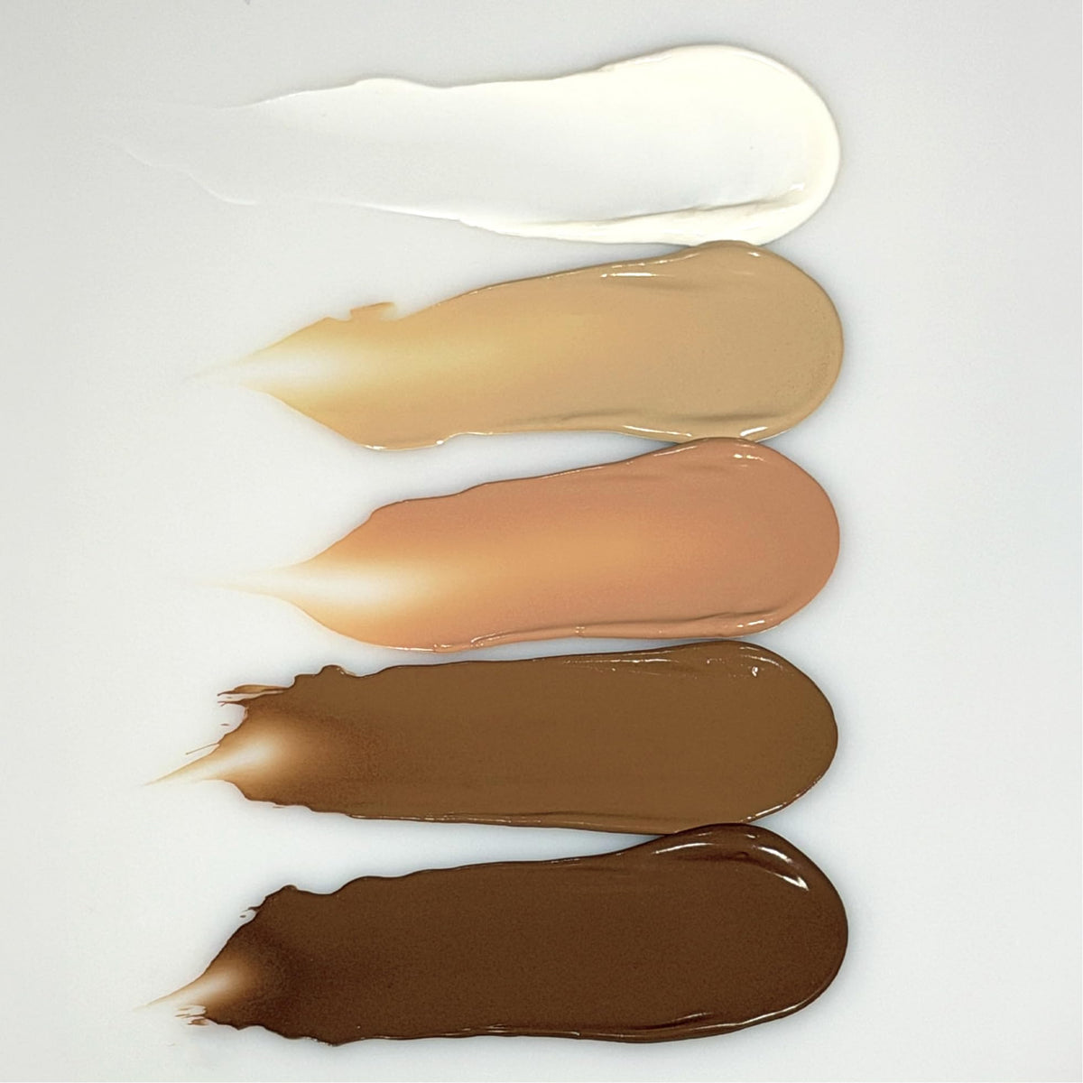 oneskin tinted swatch on skin showing natural finish and reduced white cast